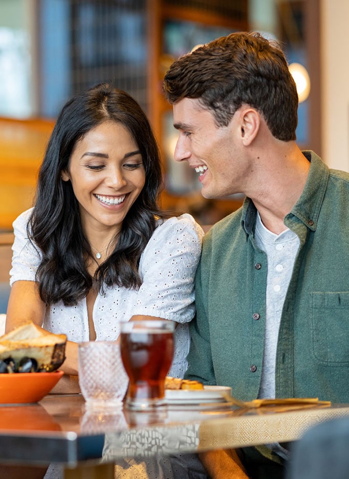 Young couple enjoying a date night at Hudson & Nash