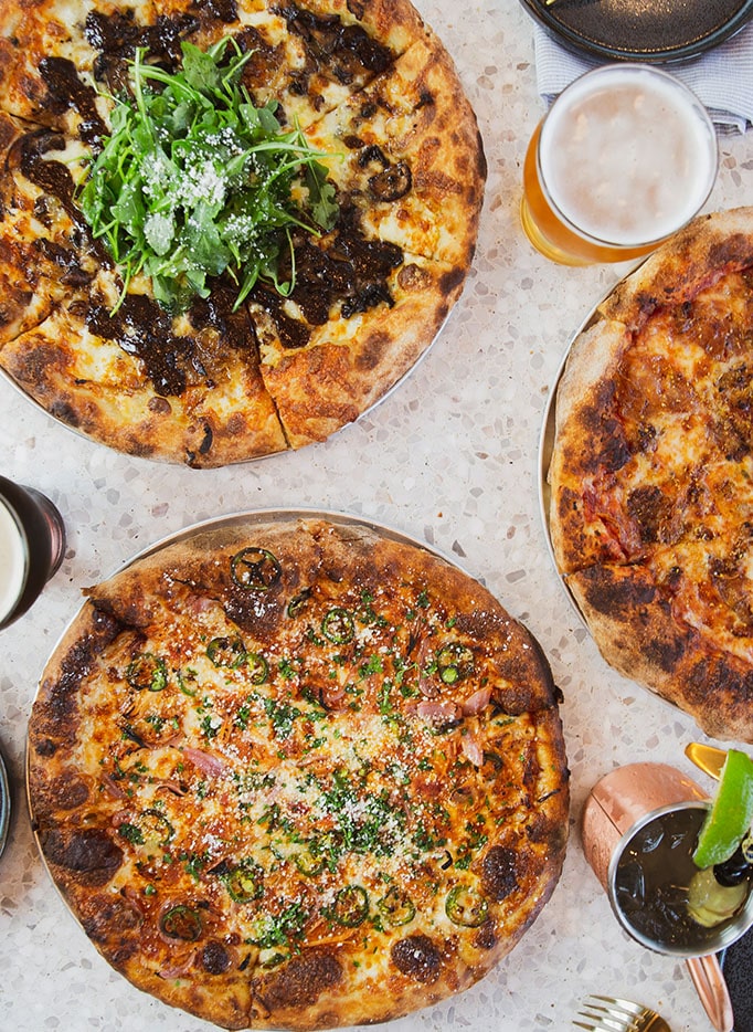 Our 3 signature pizzas. The Barrio Logan, the Shroomer and the Little Italy served with local beer and a signature cocktail.